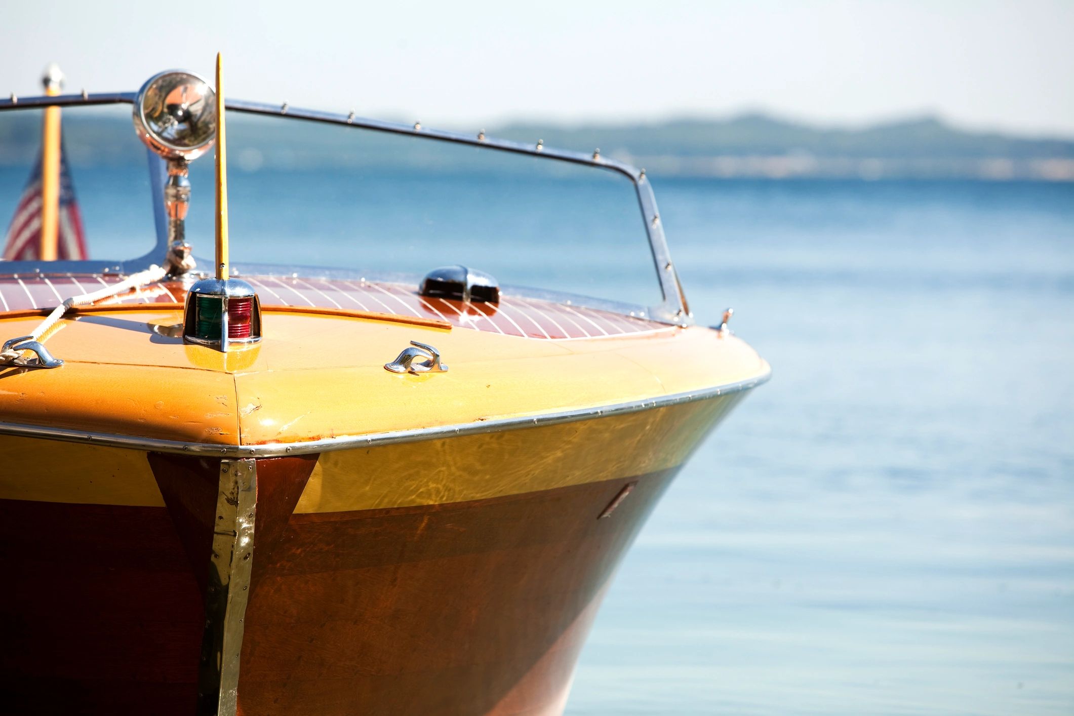 Classic wooden runabout on the water