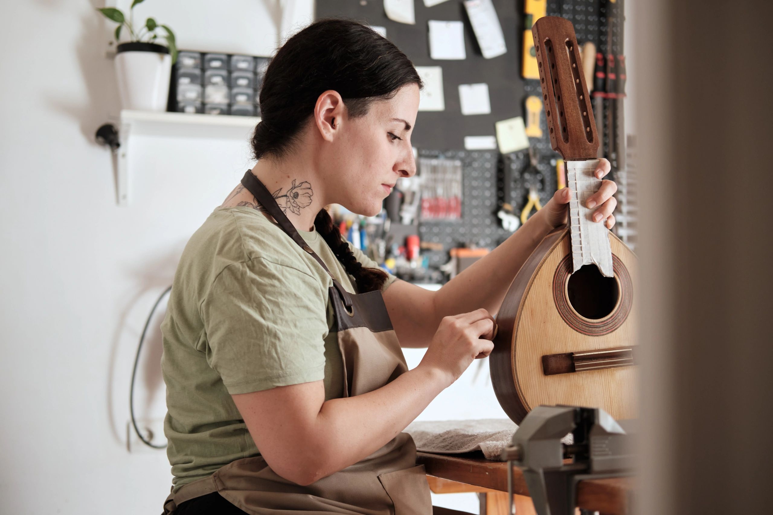 Skilled craftsperson working carefully in a restoration workshop