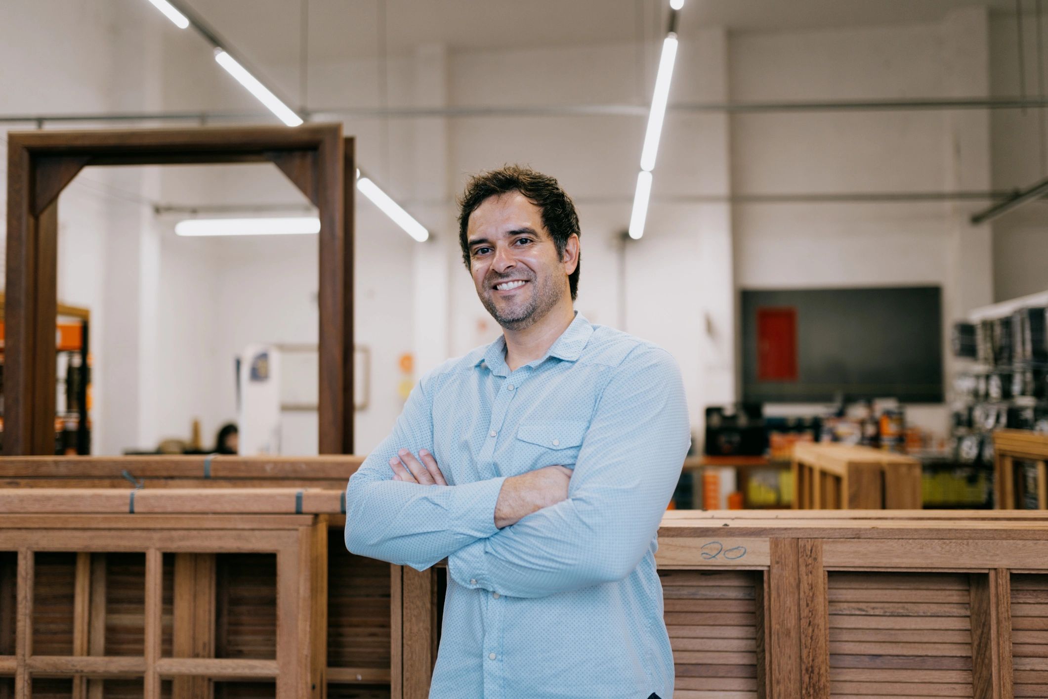 Craftsman in a woodworking shop representing hands-on restoration expertise